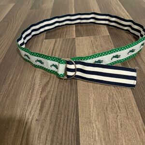 Preppy alligator print/ navy striped reversible fabric belt with ring closure.